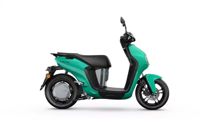 Teal-green Yamaha Neo's scooter shown in a left-side profile with black seat and wheels.