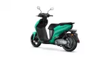 Teal Yamaha Neo's scooter photographed from a rear three-quarter view, showing handlebars, seat, and rear wheel against a white background.