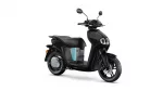 Black modern scooter with teal accent panel, side view angled, front wheel visible and headlight area prominent