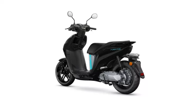 Black Yamaha NEO'S scooter photographed from the left-rear side, showing sleek body, rear wheel, and blue accent panel.