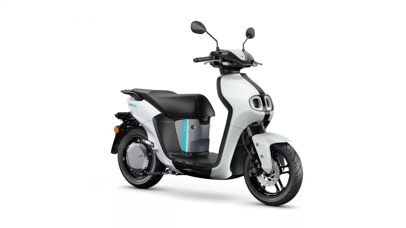 Front three-quarter view of a white and gray modern scooter with black seat and teal accent stripe on the body.