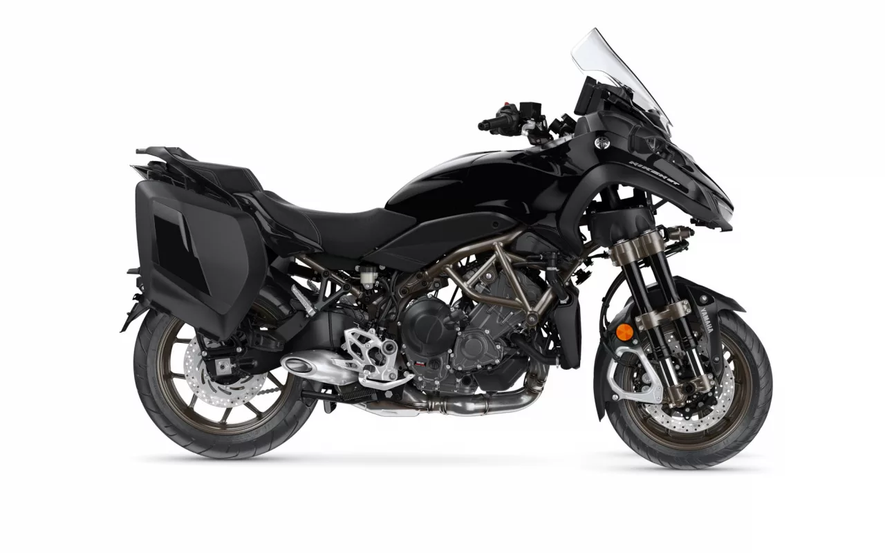 Black Yamaha adventure motorcycle with side-mounted panniers, a tall clear windscreen, and exposed engine, shown in left-front profile.