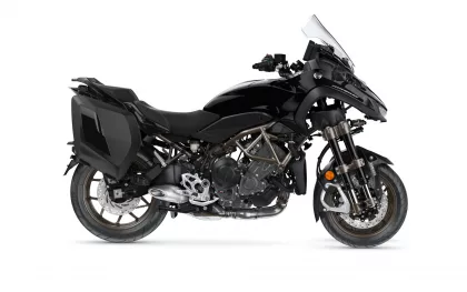 Black Yamaha adventure motorcycle with side-mounted panniers, a tall clear windscreen, and exposed engine, shown in left-front profile.