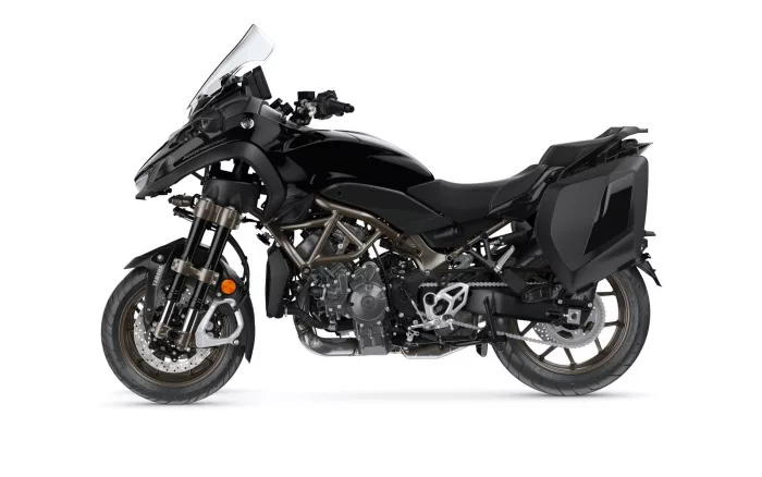 Side view of a black Yamaha adventure motorcycle with integrated side panniers and clear windscreen.