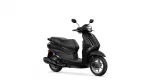 Side view of a glossy black scooter with two mirrors and a large headlight in front
