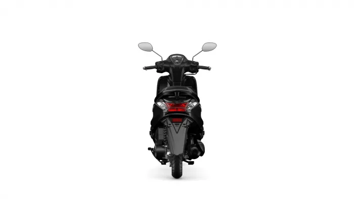 Rear view of a black scooter showing the tail light, seat, and handlebars against a white background.