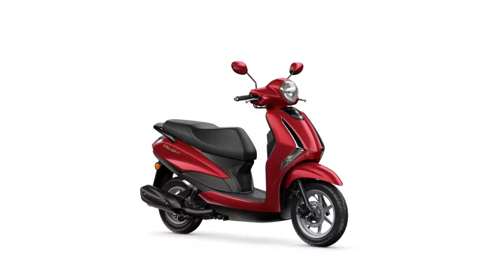 Front-right view of a red scooter with black seat, chrome mirrors, and prominent headlamp on a white background.