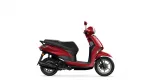 Side view of a red scooter on a white background, showing the seat, handlebars, and front wheel.