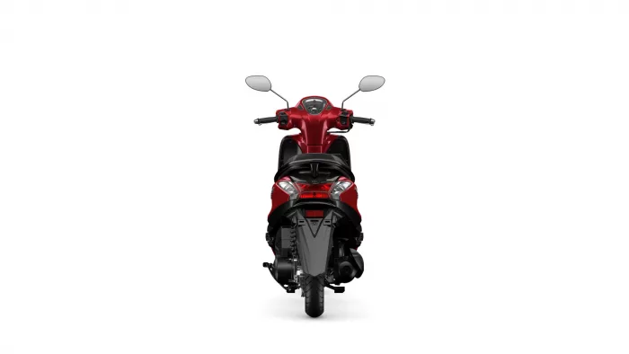 Rear view of a red scooter showing the taillights, seat, and handlebars against a white background