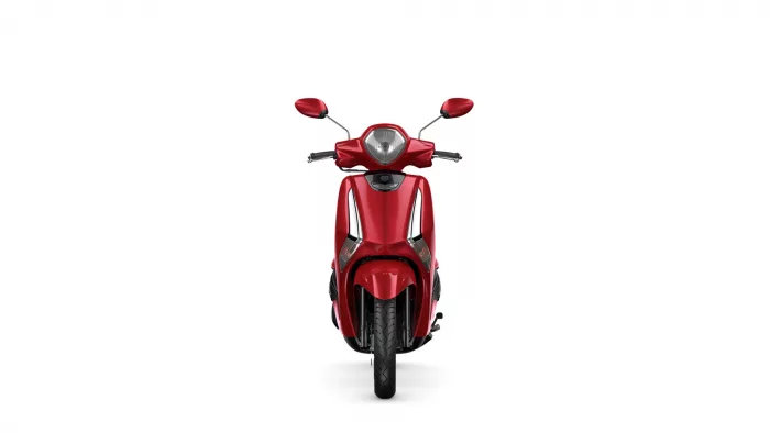 Front view of a bright red scooter with handlebars, mirrors, and headlight against a white background.