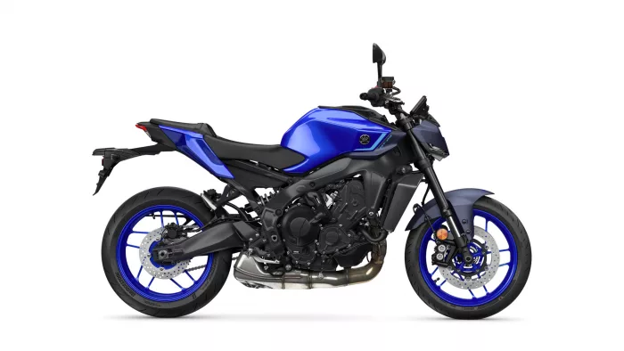 Left-side profile of a blue sport motorcycle with black frame and visible disc brakes and exhaust.