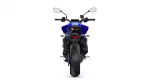 Rear view of a blue sport motorcycle with wide rear tire and mirrors on white background.