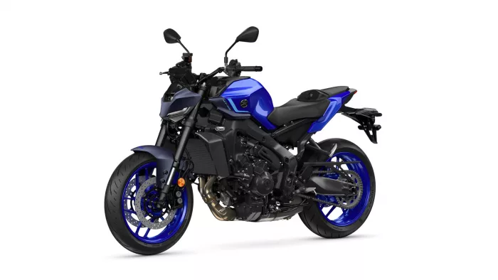 Blue sport motorcycle shown from a three-quarter front perspective, highlighting the blue fuel tank, black frame, and front disc brakes with blue rims.