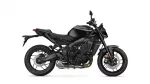 Side view of a black sport motorcycle showing its sleek body, engine, and disc brakes