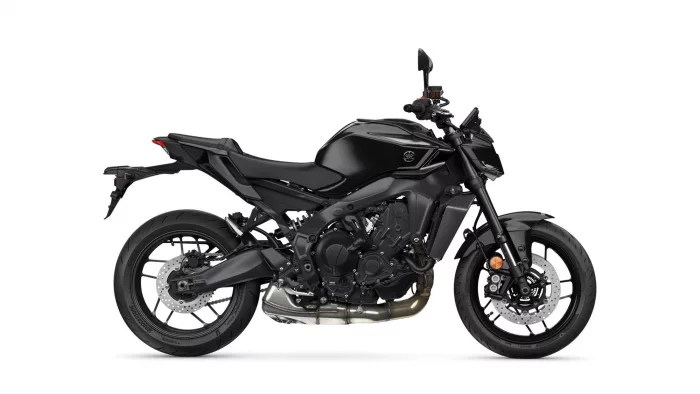 Side view of a black sport motorcycle showing its sleek body, engine, and disc brakes