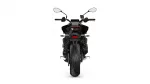 Rear view of a black sport motorcycle, showcasing the taillight, license plate area, and wide rear tire on a white background.