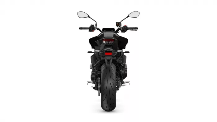 Rear view of a black sport motorcycle, showcasing the taillight, license plate area, and wide rear tire on a white background.