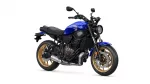Blue Yamaha motorcycle with gold wheels shown in a three-quarter front view on a white background.