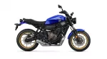 Blue Yamaha motorcycle shown in profile with gold wheels and exposed engine; sporty street bike view.