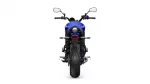 Rear view of a blue sport motorcycle, showing the wide rear tire, round taillight, and dual mirrors.