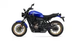 Blue Yamaha street bike shown in profile with a gold-rimmed wheel and exposed engine components