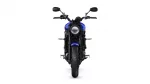 Front view of a blue Yamaha motorcycle with round headlight and mirrors on each side