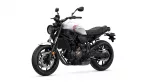 White Yamaha motorcycle shown in a side-front view with a white fuel tank, black chassis, and single-seat.