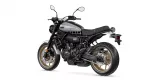 Yamaha XSR700 motorcycle photographed from a left-front three-quarter view on a white background, silver fuel tank and gold wheels visible.
