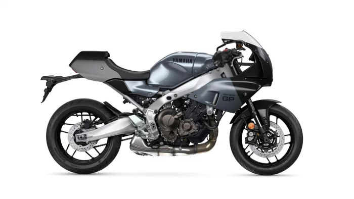 Side view of a silver Yamaha XSR900 GP sport motorcycle, showing the sleek fairing and exposed engine.