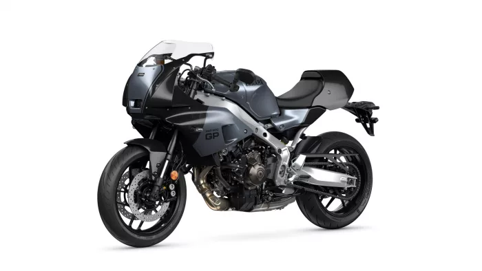 Three-quarter front-left view of a metallic gray Yamaha sport motorcycle with a clear windscreen and exposed mechanicals, on a white background.