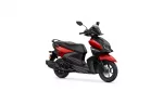 Red and black Yamaha scooter shown from a front-right perspective with a windshield and mirrors, highlighting its sleek design.