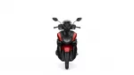 Front view of a red-and-black motorcycle facing the camera, showing its windshield, dual headlights and sporty styling.