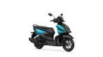 Turquoise-and-black Yamaha scooter shown from a side-front angle, highlighting its sporty design and windscreen