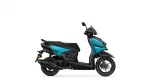 Teal and black Yamaha scooter shown from the side on a white background.