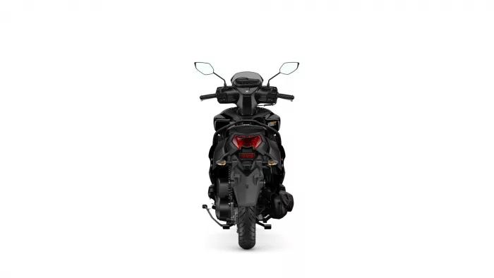 Rear view of a black motorcycle showing taillight, seat, and rear wheel from behind, against a white background.