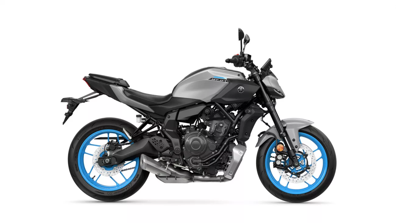 Gray Yamaha MT-07 sport motorcycle shown from the left side, featuring blue rims and exposed engine details.