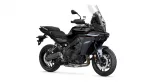 Black Yamaha Tracer sport-touring motorcycle shown from a front-right three-quarter view, with a tall windshield and exposed engine.