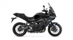 Side view of a black Yamaha Tracer sport-touring motorcycle with a tall windshield and exposed engine on a white background.
