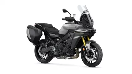 Gray Yamaha sport-touring motorcycle with black hard side panniers and a tall windshield.",