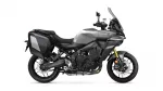 Side view of a gray sport-touring motorcycle with black hard panniers and a tall windshield.