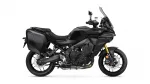 Black Yamaha Tracer sport-touring motorcycle with side panniers and windshield viewed profilewise