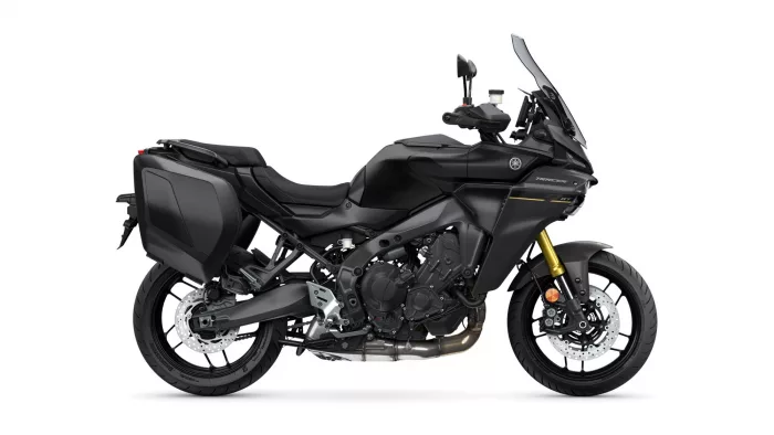 Black Yamaha Tracer sport-touring motorcycle with side panniers and windshield viewed profilewise