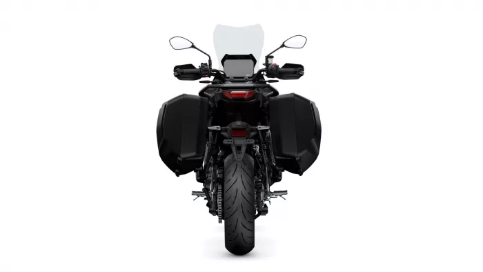 Rear view of a black adventure motorcycle with large side panniers and a windshield key feature.