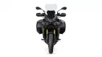 Front view of a black adventure motorcycle with a tall windscreen and dual headlights, flanked by side panniers.