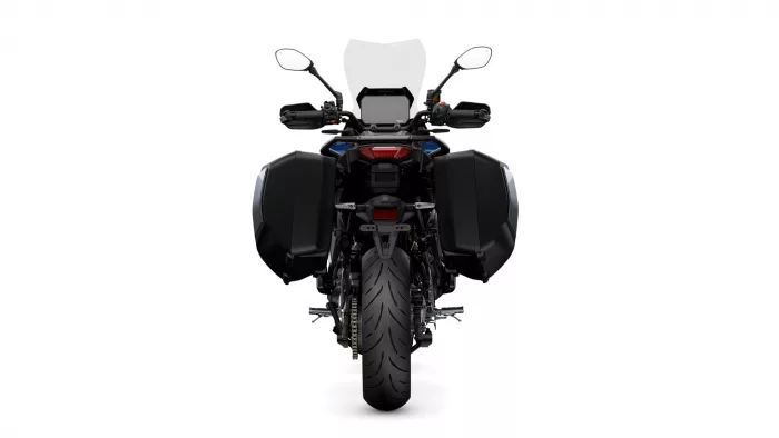 Rear view of a black motorcycle with large side panniers, a tall windshield, and a central taillight on a white background.
