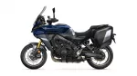 Blue and gray Yamaha adventure motorcycle shown in side profile with hard panniers and tall windshield