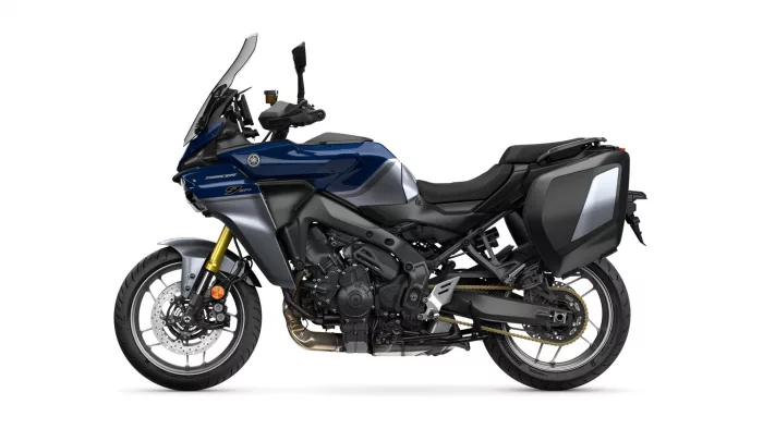 Blue and gray Yamaha adventure motorcycle shown in side profile with hard panniers and tall windshield