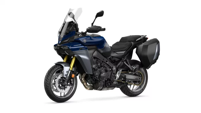Blue Yamaha Tracer 9 GT adventure motorcycle with windscreen and side panniers on a white background