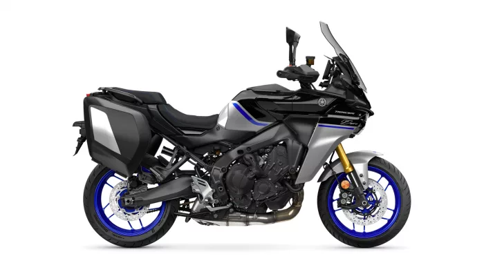 Black and silver Yamaha Tracer sport-touring motorcycle with blue accent stripes and side panniers.