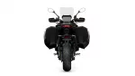 Rear view of a black adventure motorcycle with large side panniers and a tall windshield.